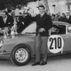 Vic Elford of Great Britain holds aloft the trophy as he stands beside the #210 Porsche 911T after winning the Monte Carlo Rally on 25 Jan 1968 in the Principality of Monaco in Monte Carlo, Monaco